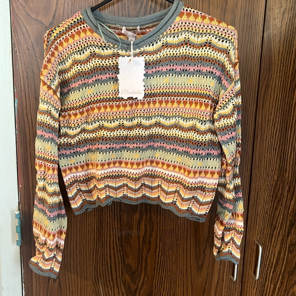 Woman’s knitted sweater.